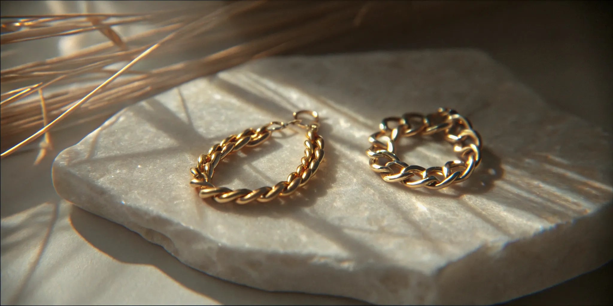 14K and 18K yellow gold jewelry displayed side by side