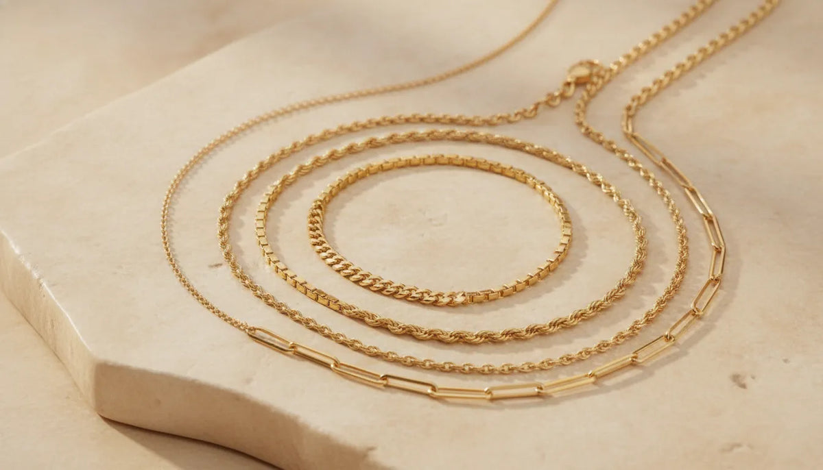 Different fine jewelry necklace chain styles arranged in a studio
