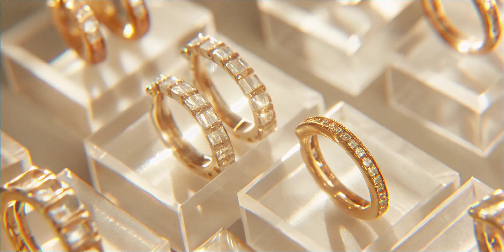 Gold baguette diamond hoop earrings.