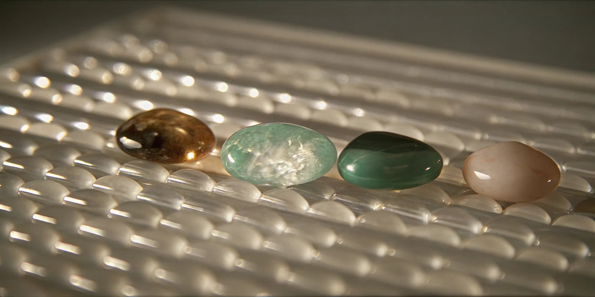 Various gemstones representing the hardness scale and their durability for jewelry.