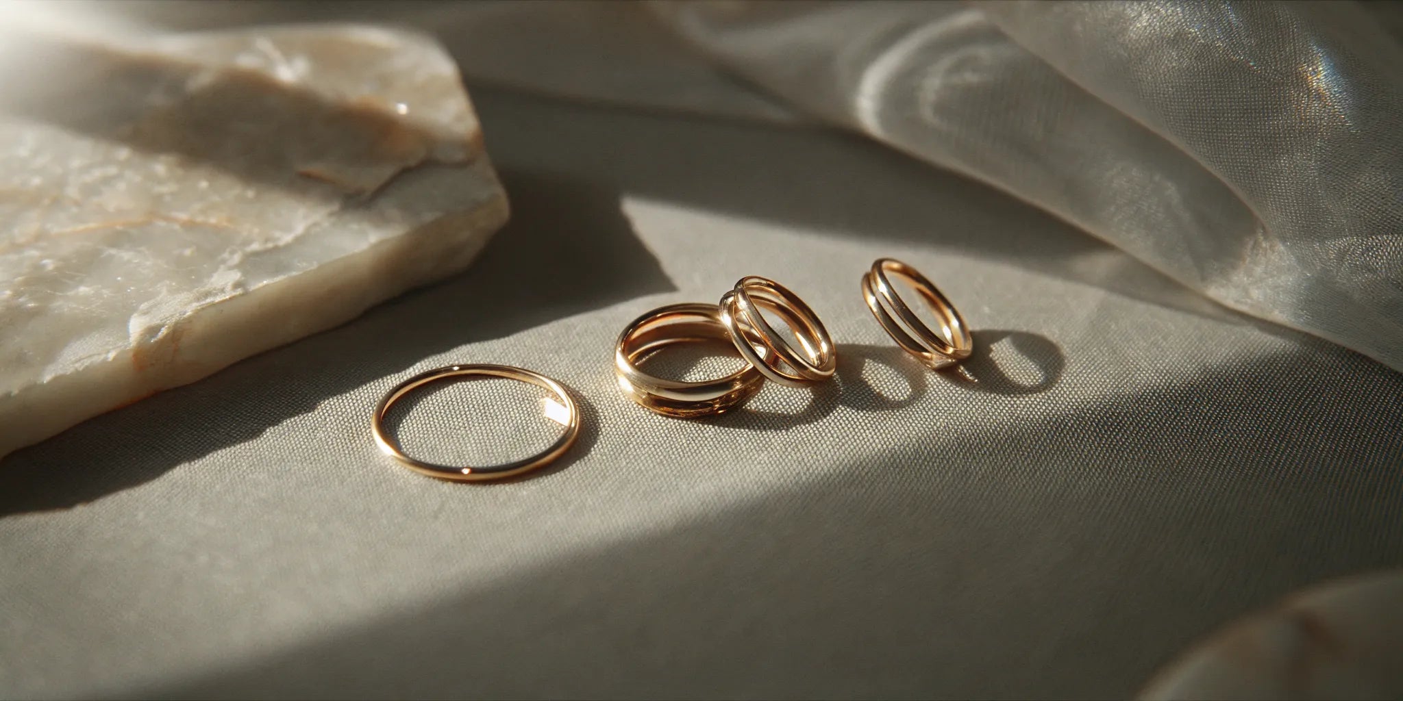 A collection of unique custom wedding bands for her in yellow and white gold.