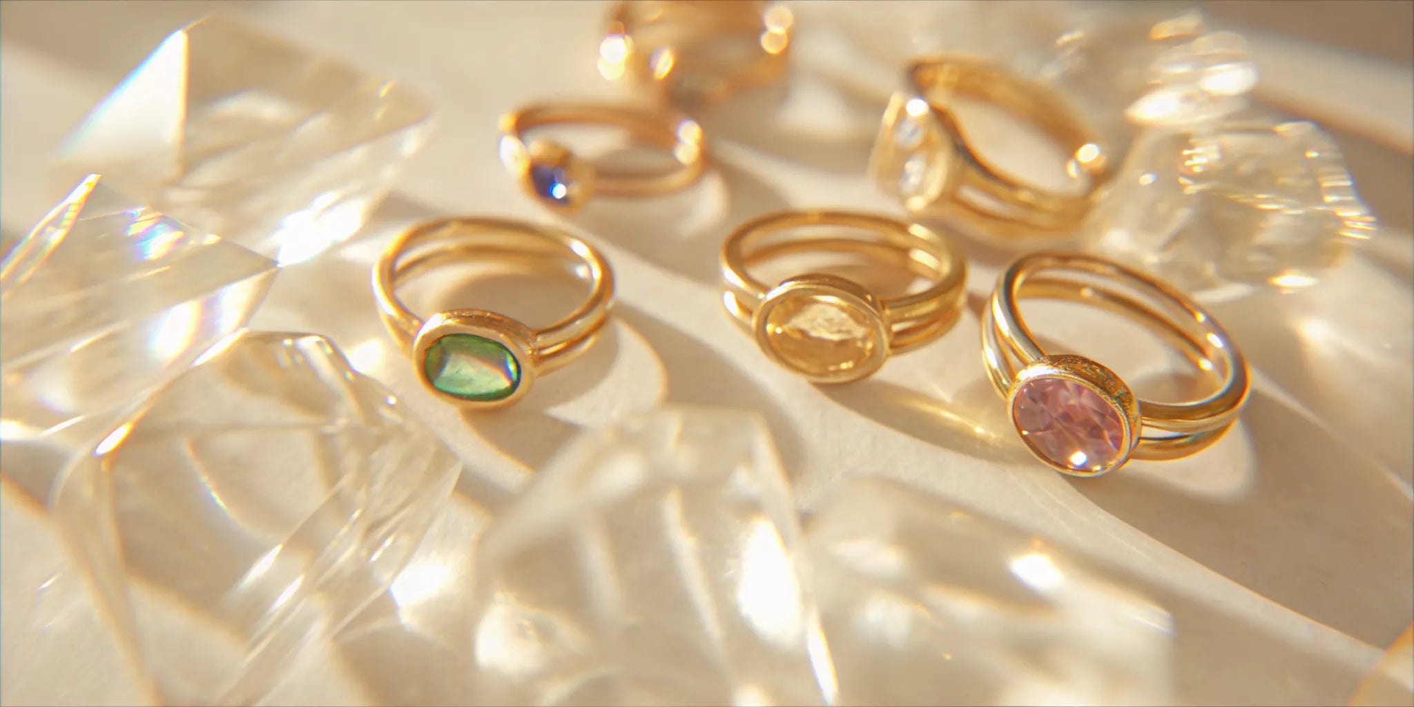 Solid gold cocktail rings with colorful natural gemstones.