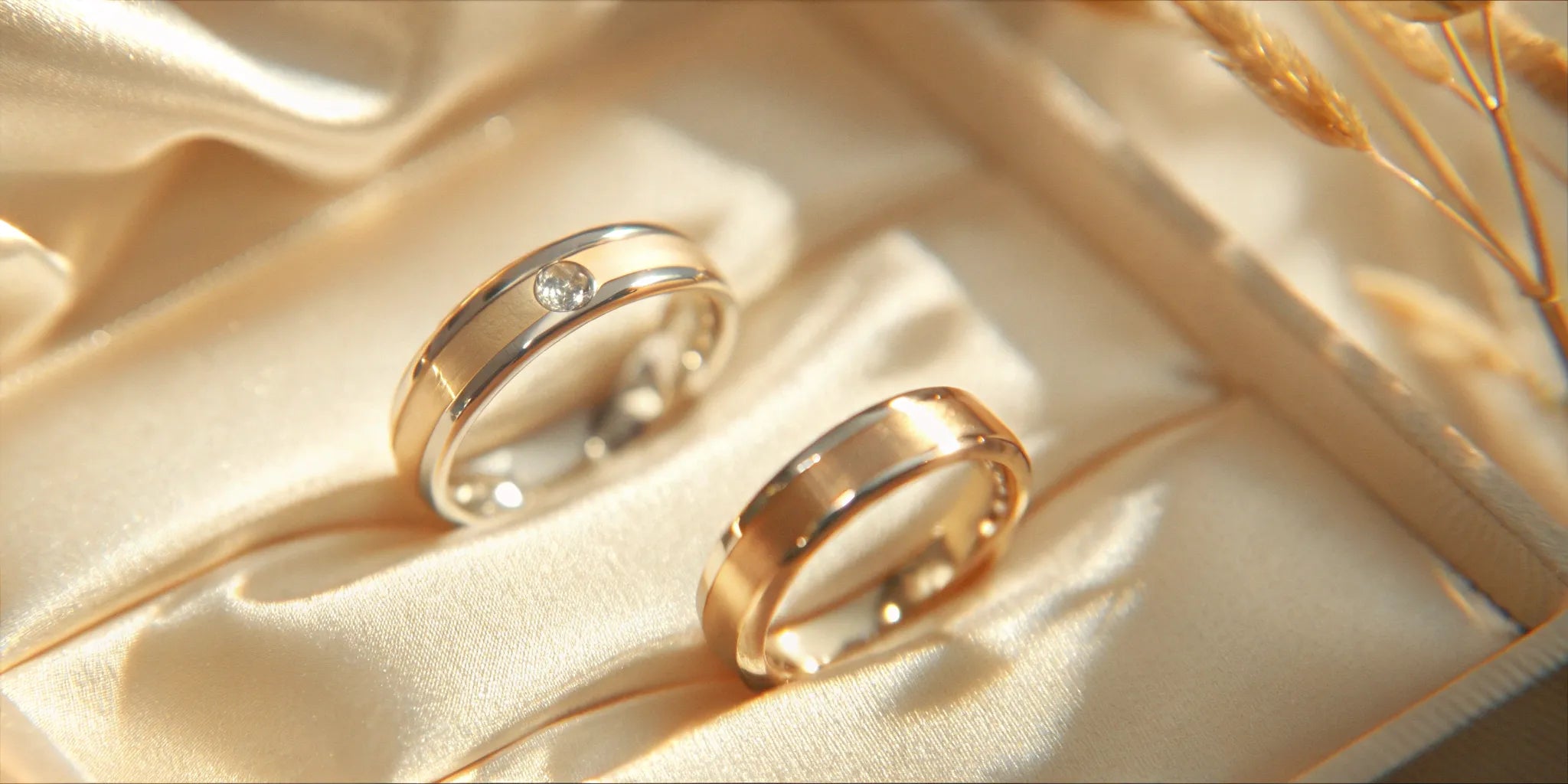 Gold wedding band set with a diamond accent.