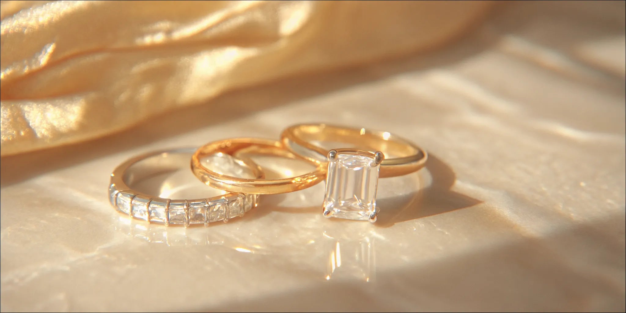 A gold wedding ring set with a brilliant emerald and surrounding diamonds.
