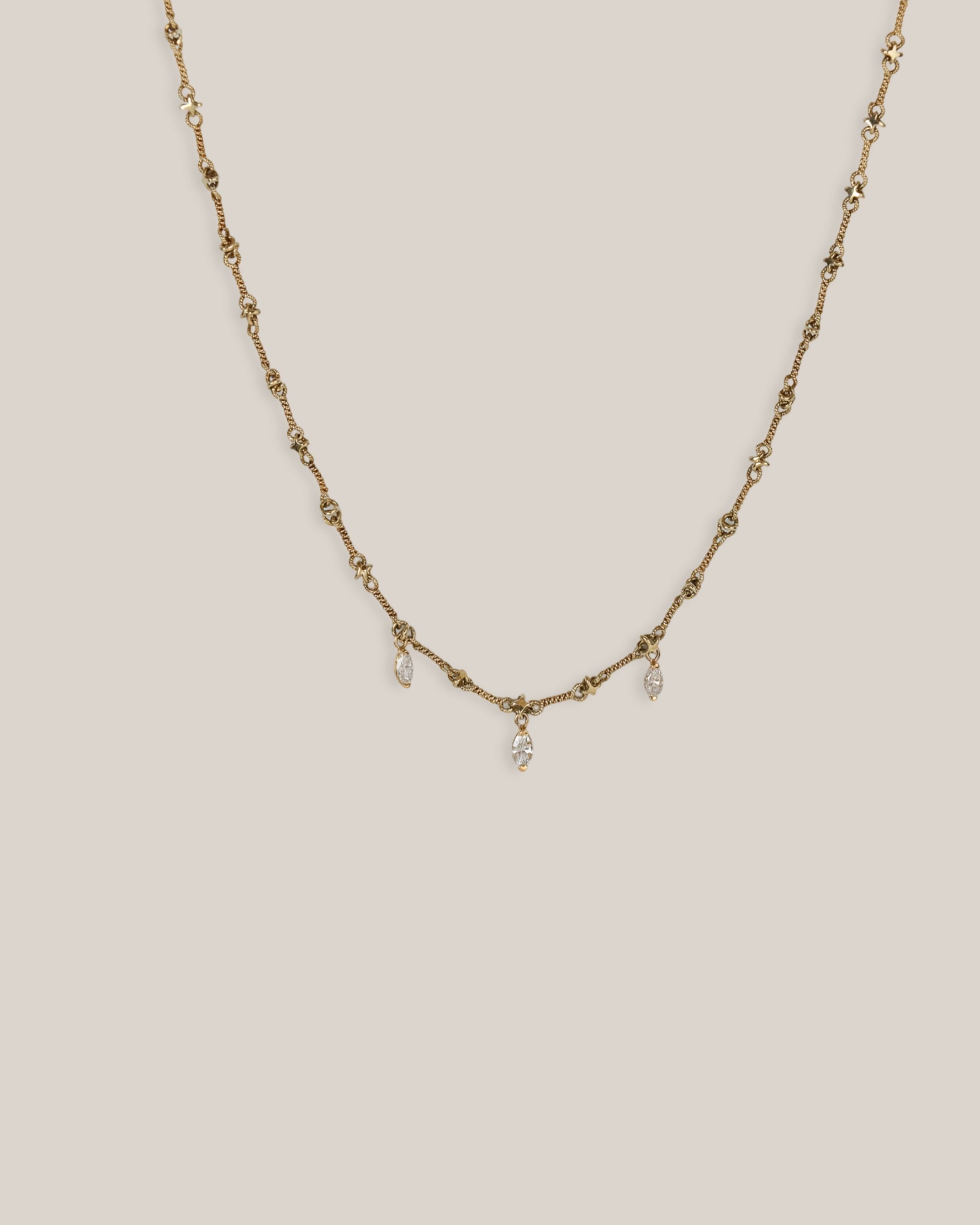 18ky Twist .35ct Marquise Dangle Necklace ft Heart Lobster Claw
