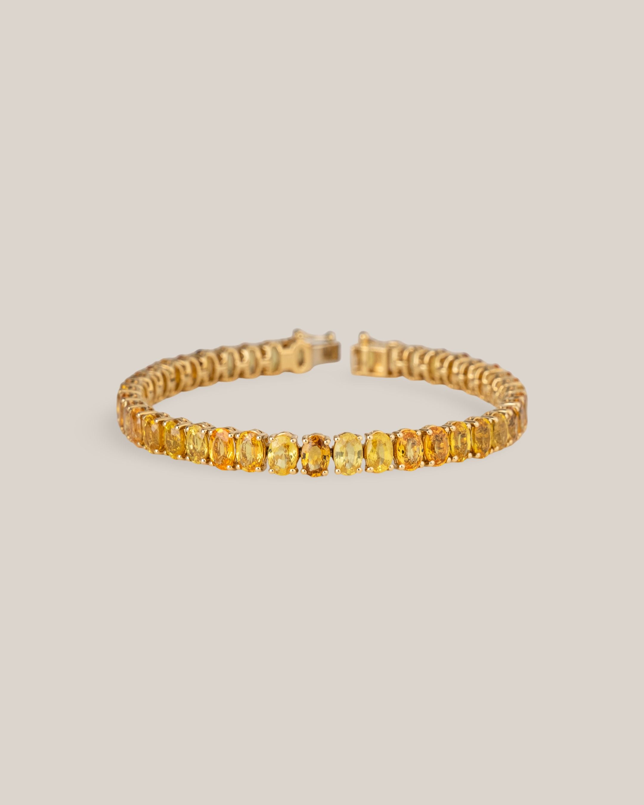 18ky 22.79 CT Oval YS Tennis Bracelet